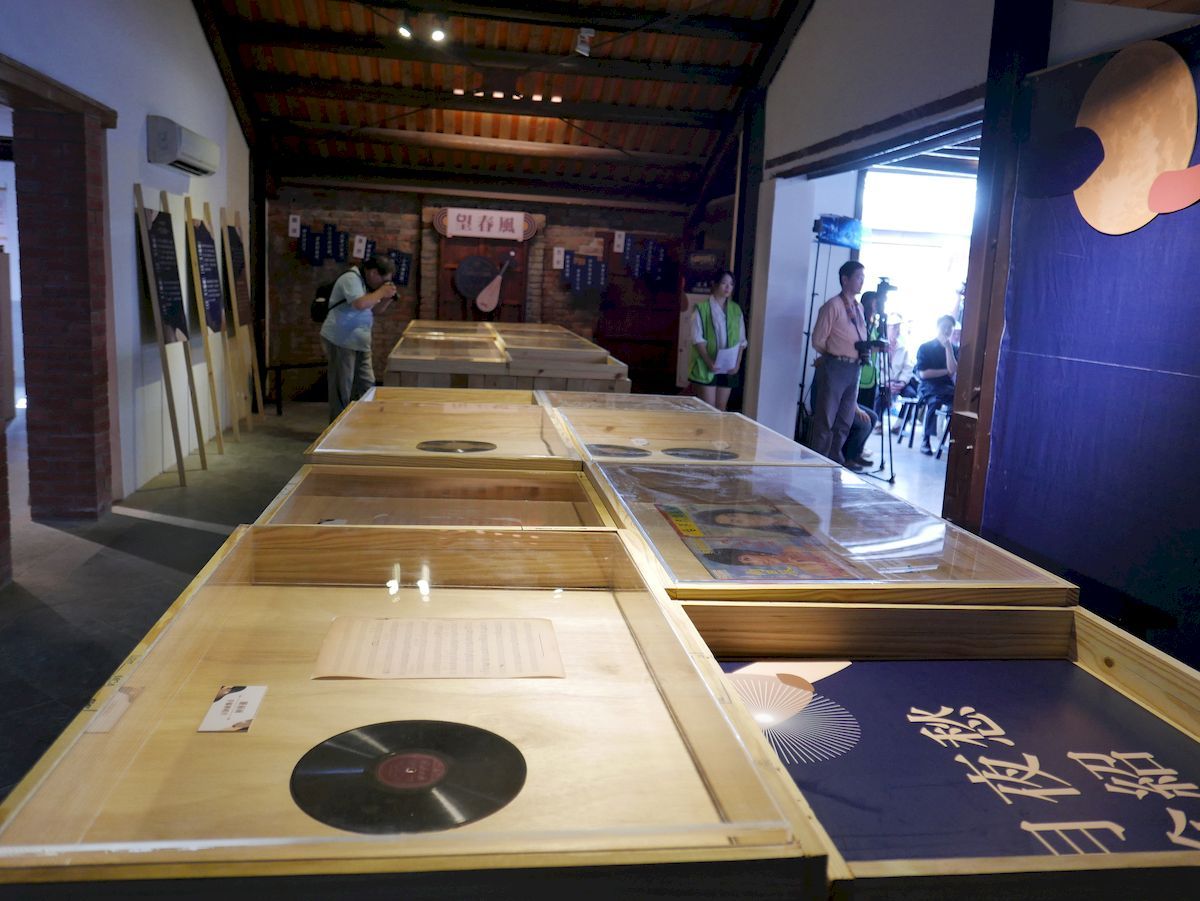 Some of Deng's manuscripts of musical notes and shellac discs on display.
